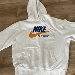 Nike White Hoodie with Bold Orange and Blue Accents